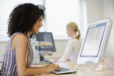 Businesswomen working at desks