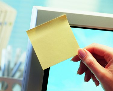 Woman holding blank paper