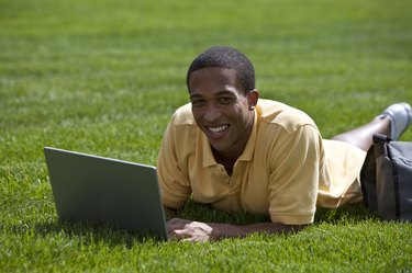 student laying down outside