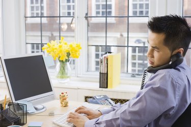 Businessman on phone at desk