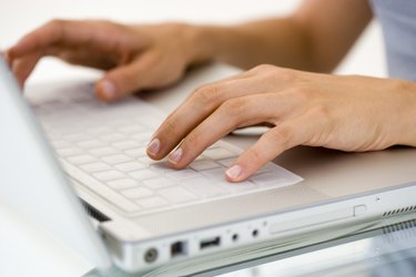 Woman's hands typing