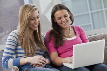 Students doing homework on a laptop