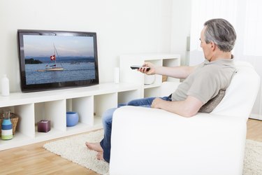 Mature man watching tv