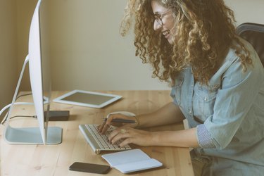 Young woman working at home or in a small office