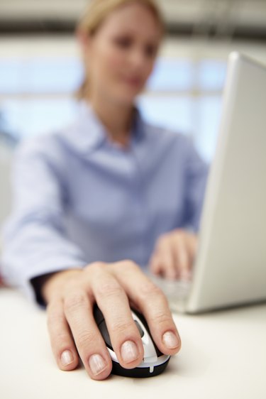 Businesswoman using laptop