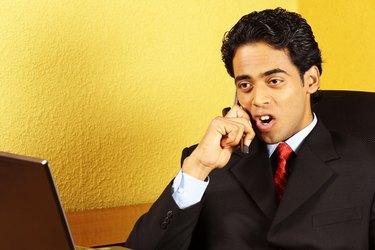 A business man talking on cell phone
