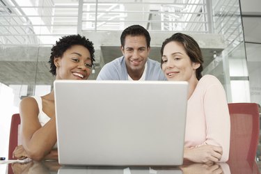 Businesspeople Using Laptop