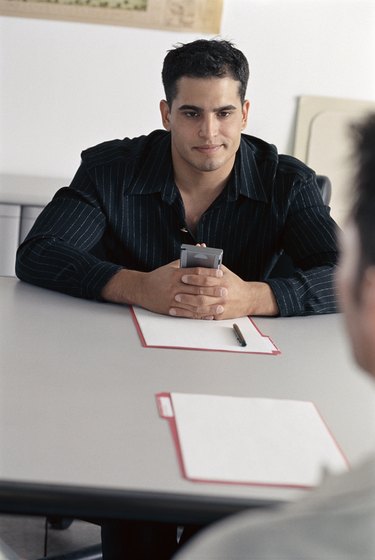 Professional man sitting at a table