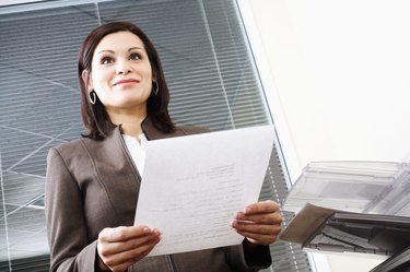 Businesswoman holding paper