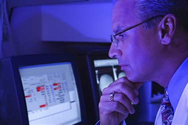 Technician using computer in laboratory