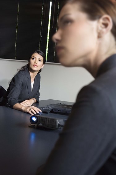 Businesswomen with projector