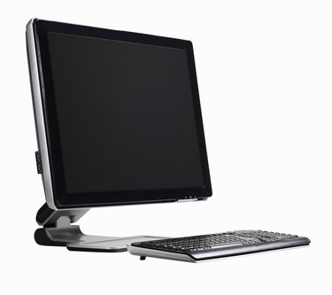 Computer flat screen and keyboard - side view