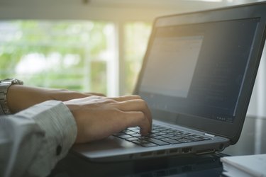 Close up hand type on keyboard labtop in home office