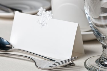 Blank wedding place card in formal table setting