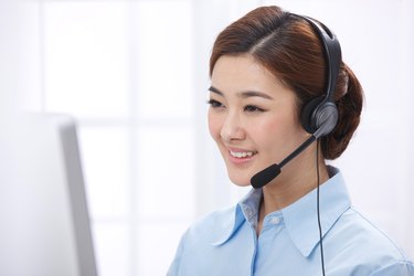 Young business lady wearing headset