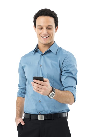 Businessman Texting On Cell Phone