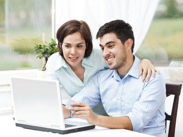 Happy couple shopping online