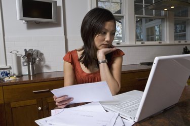woman on computer doing bills