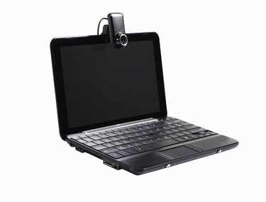Black laptop with webcam, side angle view