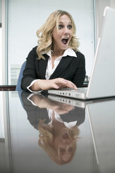 Woman at desk using computer