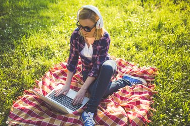 Girl with glasses using laptop