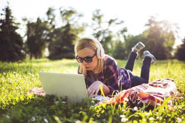 Woman listening to music  at the park