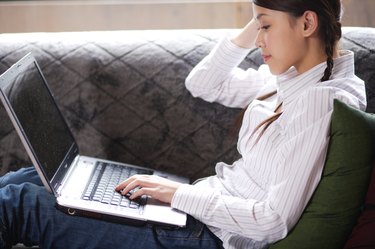 A young woman operating the computer