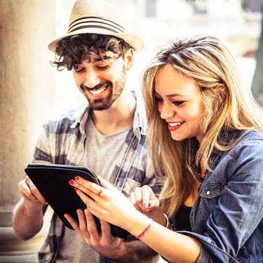 Friends Watching Multimedia Content on a Digital Tablet