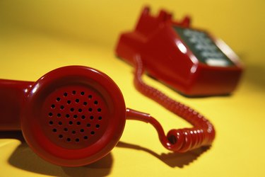 Close-up of a telephone receiver off the hook