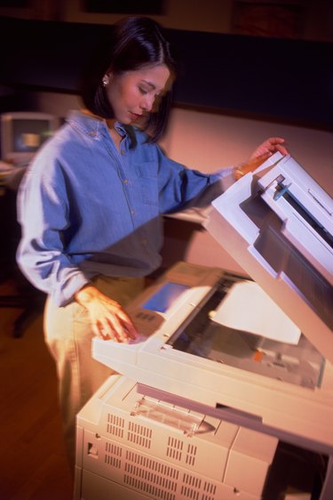 Businesswoman using copy machine