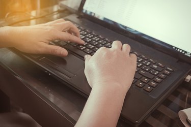 Close-up of typing female hands on keyboard