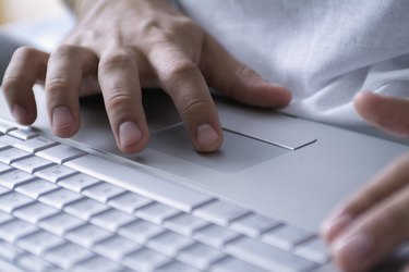 Human Hands operating a Laptop