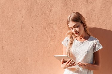 Elegant young woman using tablet