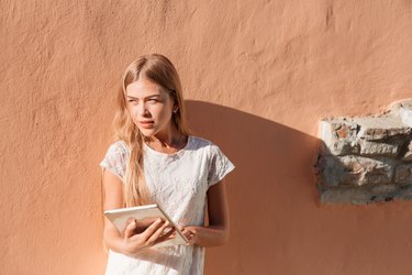 Elegant young woman using tablet