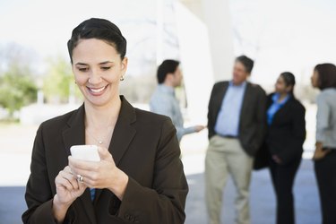 Businesswoman reading a text message