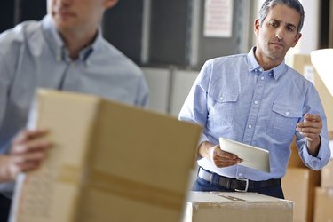 Manager Using Headset In Distribution Warehouse