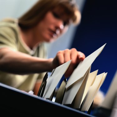 Woman Filing Letter