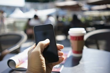 using mobile phone in a cafe