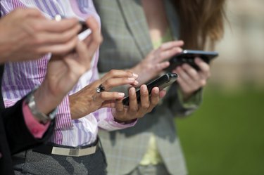 Three Businesswomen Texting