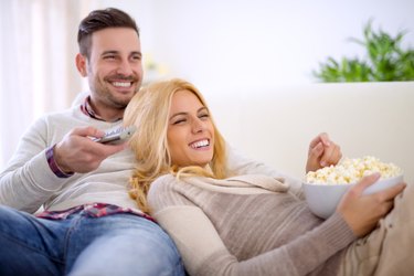 Couple at home watching TV
