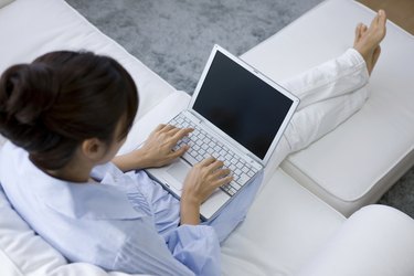 Young woman playing computer