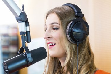 Female presenter in radio station on air