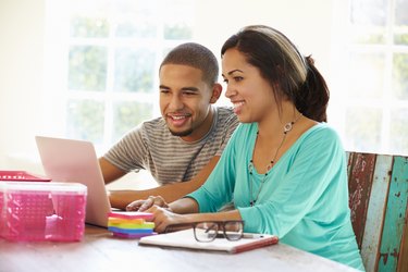 Couple Working In Office At Home