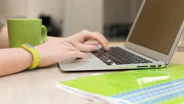 Young female working on Laptop close up View