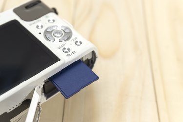 insert or remove memory card from camera.