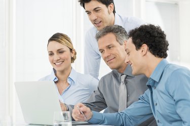 Businesspeople Working At Laptop