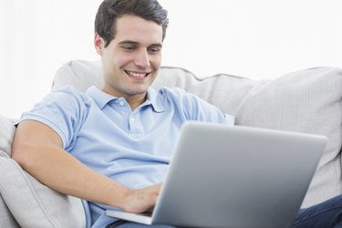 Attractive man using his laptop