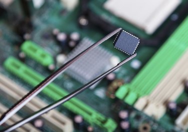 computer chip with tweezers, electronic