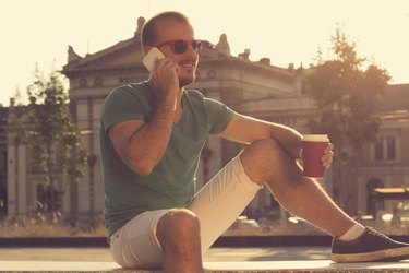 Young handsome man using smartphone.