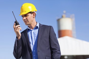 construction manager using walkie talkie